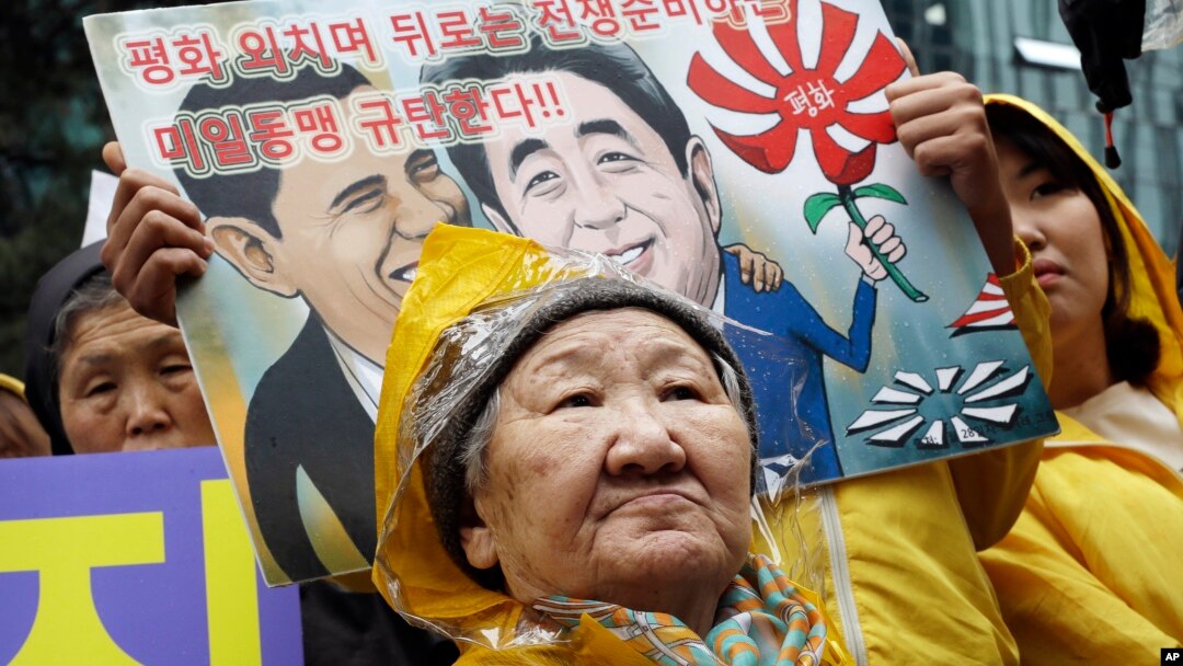 FILE - Former comfort woman Kil Un-ock, forced into sexual slavery to Japanese troops during World War II, attends a rally protesting a U.S. visit by Japanese Prime Minster Shinzo Abe, outside the Japanese Embassy in Seoul.
