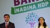 Selahattin Demirtas (L) and Figen Yuksekdag, co-chairs of the pro-Kurdish Peoples' Democracy Party, address their party members as they start their campaign for Turkey's November 1 parliamentary elections, during a meeting in Ankara, Oct. 2, 2015. The ban