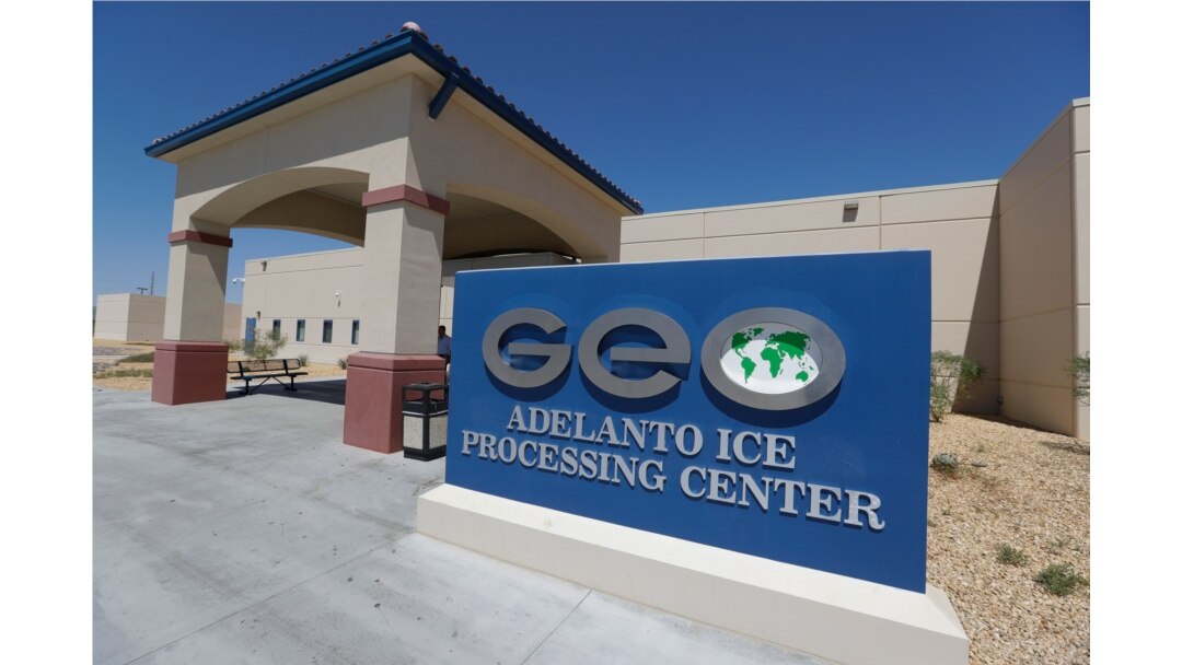 FILE - The Adelanto U.S. Immigration and Enforcement Processing Center operated by GEO Group, Inc., a Florida-based company specializing in privatized corrections, is seen in Adelanto, Calif., Aug. 28, 2019.