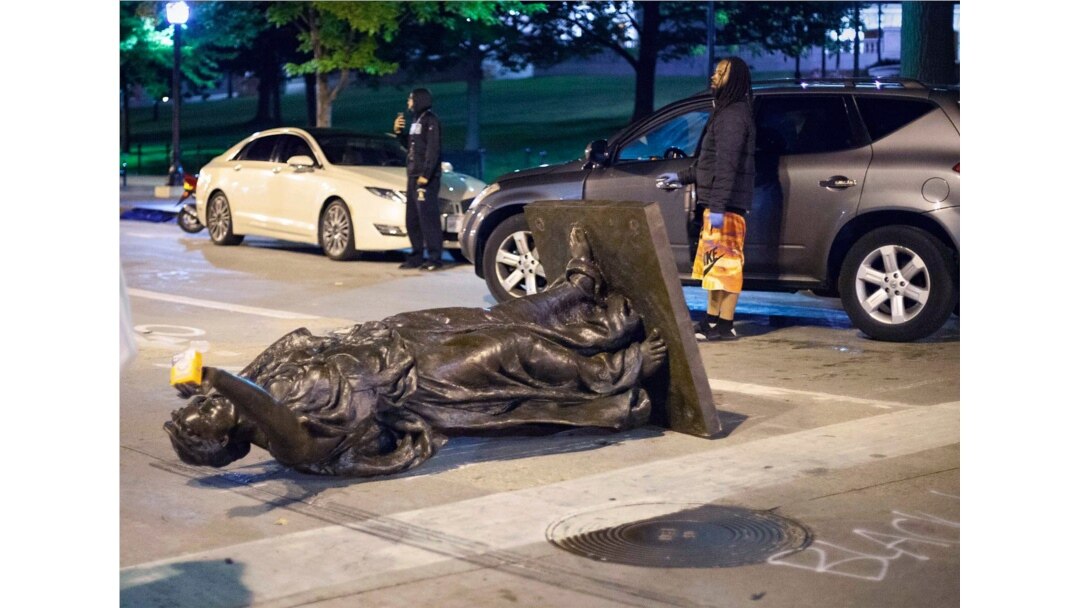 Wisconsin's 'Forward' statue lies in the street on Capitol Square in Madison, Wis., June 23, 2020.