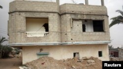 A broken and deserted house, which has a tunnel running underground, is seen in the Egyptian border city of Rafah, May 13, 2013. The house was destroyed due to the construction of the tunnel used for smuggling things from Egypt into Gaza. 