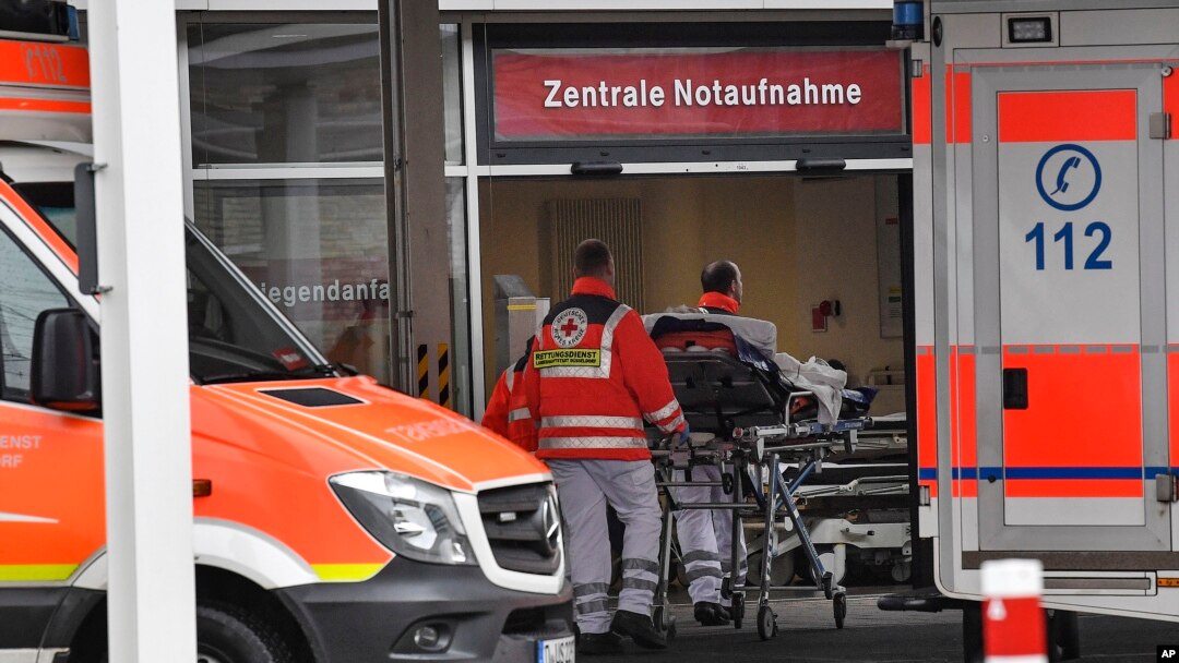 Paramedics work at the University Hospital in Duesseldorf, Germany, where a man who tested positive for the coronavirus is being treated, Feb. 26, 2020.