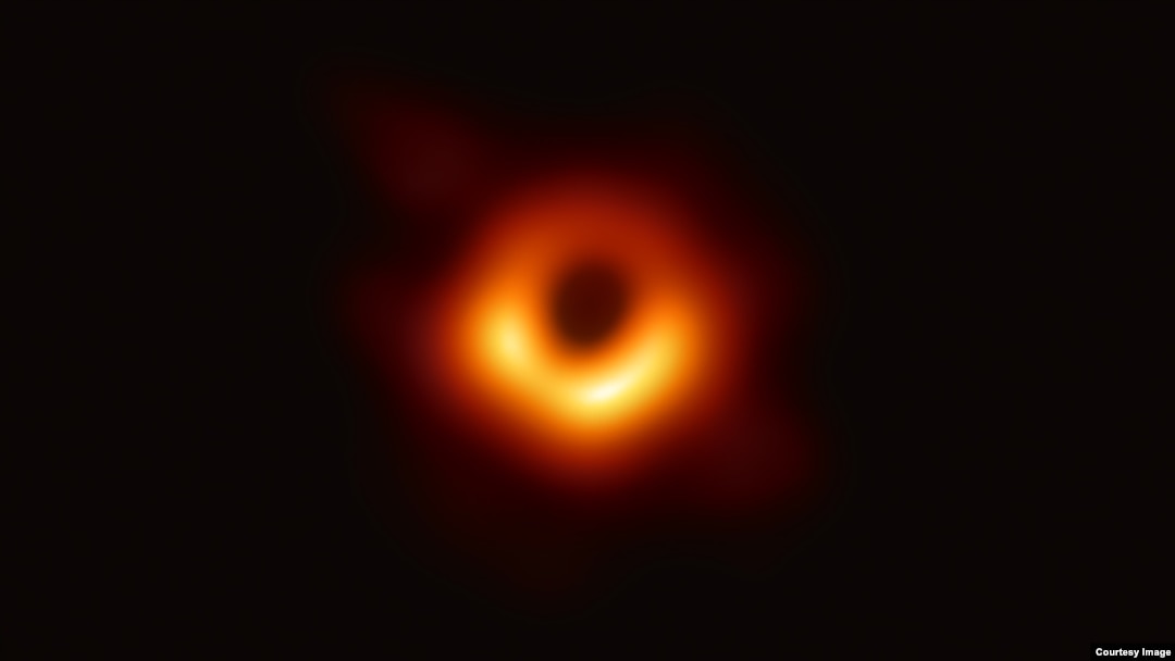 An image of the black hole at the center of Messier 87, a massive galaxy in the nearby Virgo galaxy cluster. This black hole resides 55 million light-years from Earth and has a mass 6.5-billion times that of the Sun.