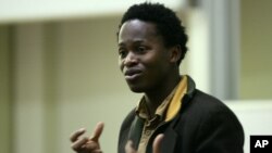 Ishmael Beah, formerly of Sierra Leone and author of the book "A Long Way Gone: Memoirs of a Boy Soldier," talks to the students and staff at Brunel University in London, January 30, 2008.