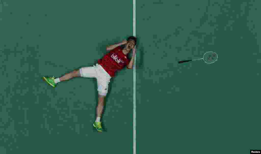 Indonesia's Kevin Sanjaya Sukamuljo celebrates victory in the All England Open Badminton Championships men's doubles final match in Birmingham, central England.