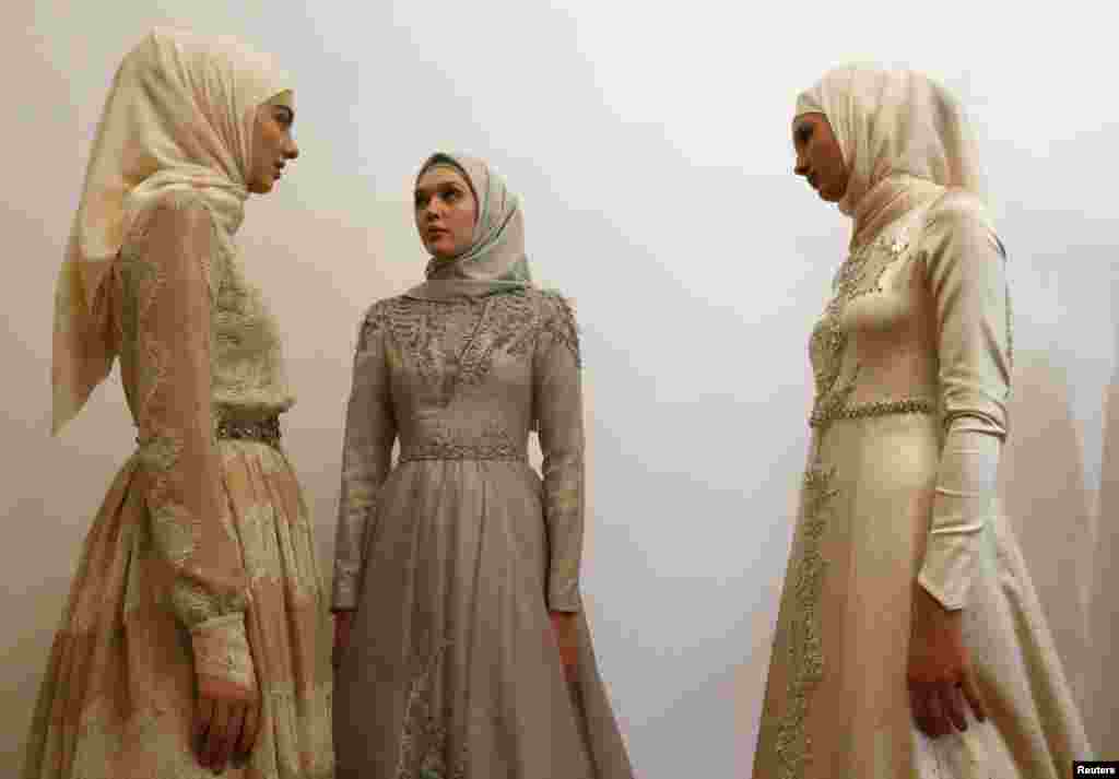 Models gather before a show of the Firdaws fashion house led by Aishat Kadyrova, daughter of the Chechen Republic head Ramzan Kadyrov, at the Mercedes-Benz Fashion Week Russia in Moscow, Russia.