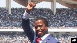 FILE - Zambian President Edgar Lungu waves during his inauguration in Lusaka, Sept. 13, 2016. "As president of this country it is my responsibility to respond to forestall chaos," he said Wednesday in reference to a state-of-emergency order he's seeking in the wake of the Lusaka City Market fire.