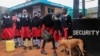 A boy strokes a dog before entering the Stara Rescue Centre and School during the reopening of schools, for the delayed academic year 2021, amid the novel coronavirus disease (COVID-19) pandemic, in Kibera slums of Nairobi, Kenya July 26, 2021.
