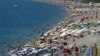 FILE - Local and foreign tourists fill Konyaalti beach in Antalya, southern Turkey, Aug. 29, 2006. The tourism industry has taken a big hit this year because of security threats.