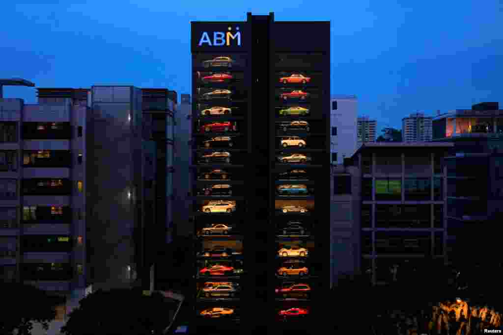 A used car dealership designed to resemble a vending machine is seen in Singapore. The dealership houses up to 60 exotic cars in a 15 story building which uses a fish-bone type lift system to deliver cars to clients within minutes.
