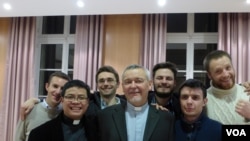 Reverend Georges Colomb with priests from the Roman Catholic Foreign Missions Society of Paris. (Lisa Bryant/VOA)