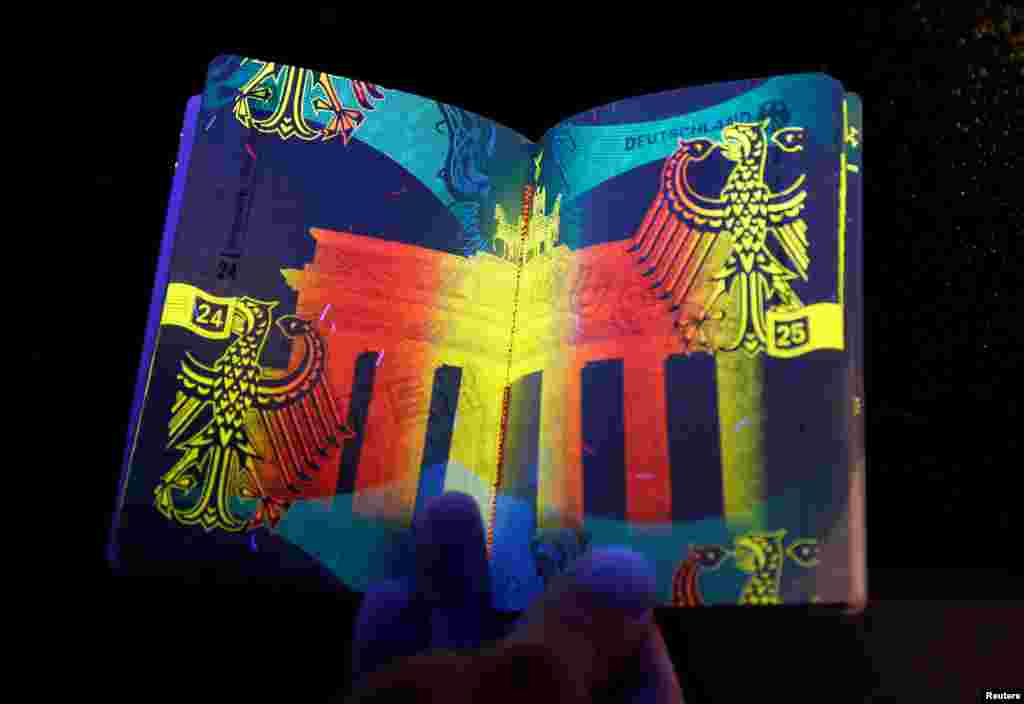 The new German electronic passport is pictured under an ultraviolet light during its presentation to the media in Berlin, Germany.
