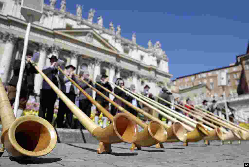 Alpenhorn players perform during Pope Francis' weekly general audience in St. Peter's Square, at the Vatican.
