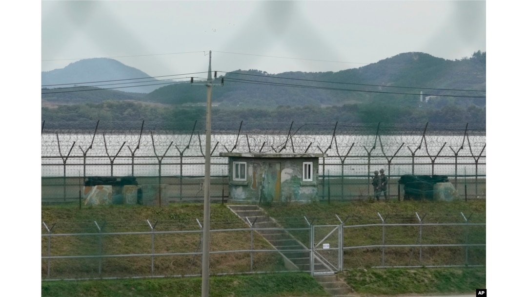 South Korean army soldiers patrol along the barbed-wire fence in Paju, South Korea, near the border with North Korea, Oct. 14, 2024.