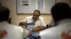 An official counts ballots at a polling station in Tripoli, Libya, Saturday, July 7, 2012. 