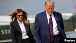 UMongameli Donald Trump lomkakhe, uNkosikazi Melania Trump, bekhankasela ukhetho lukamongameli esabelweni seOhio. 