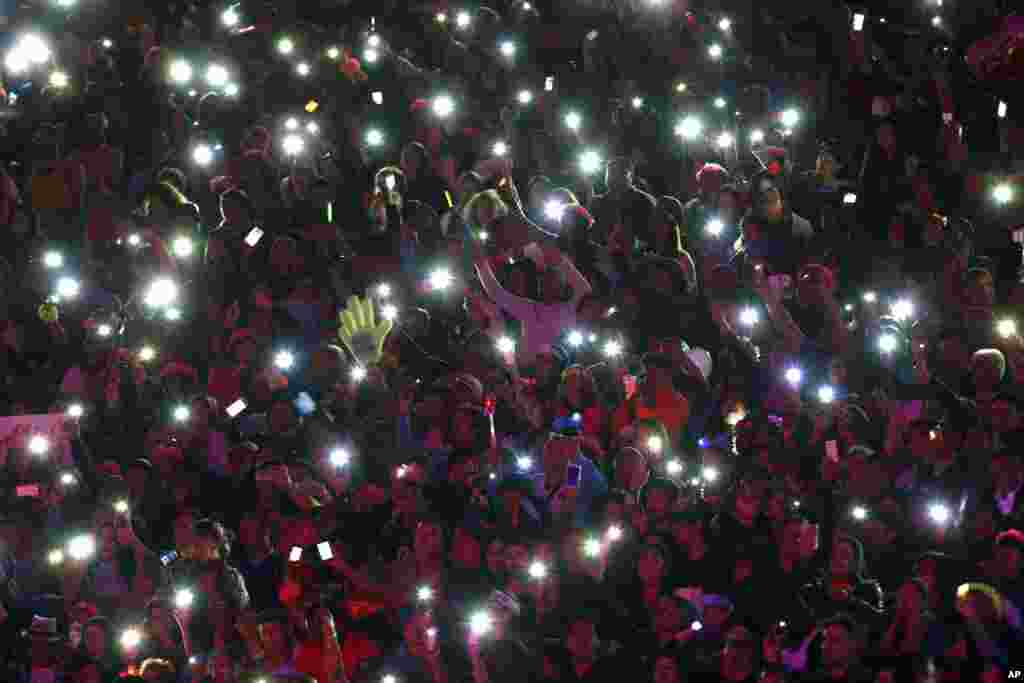 Fans of Spanish singer Isabel Pantoja light up with their mobile phones during her performance during the Viña del Mar International Song Festival at the Quinta Vergara in Viña del Mar, Chile, Feb. 22, 2017.
