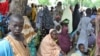 FILE - Civilians who fled their homes following an attacked by Islamist militants in Bama, take refuge at a School in Maiduguri, Nigeria.