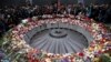 File - People attend a commemoration ceremony to mark the centenary of the mass killing of Armenians by Ottoman Turks at the Tsitsernakaberd Memorial Complex in Yerevan, Armenia, April 2015.