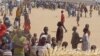FILE - Refugees that fled their homes due to violence from the Islamic extremists group Boko Haram inside a refugee camp in Minawao, Cameroon, Feb. 25, 2015.