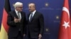 German Foreign Minister Frank-Walter Steinmeier, left, and Turkish Foreign Minister Mevlut Cavusoglu speak before their meeting in Ankara, Turkey, Nov. 15, 2016.
