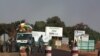 A public transport minibus is stopped by Malian soldiers at a checkpoint at the entrance to Markala, approximately 40 km outside Segou on the road to Diabaly, in central Mali, Jan. 14, 2013.