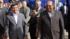 Iran's President Mahmoud Ahmadinejad (L) walks with Sudan's President Omar Hassan al-Bashir after talks focused on boosting political and economic ties between their countries, at the Khartoum international airport September 26, 2011.