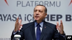 Turkey’s President Recep Tayyip Erdogan addresses his supporters in Ankara, Jan. 28, 2016.