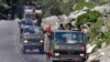An Indian Army convoy moves along a highway leading to Ladakh, at Gagangeer in Kashmir's Ganderbal district, June 18, 2020.