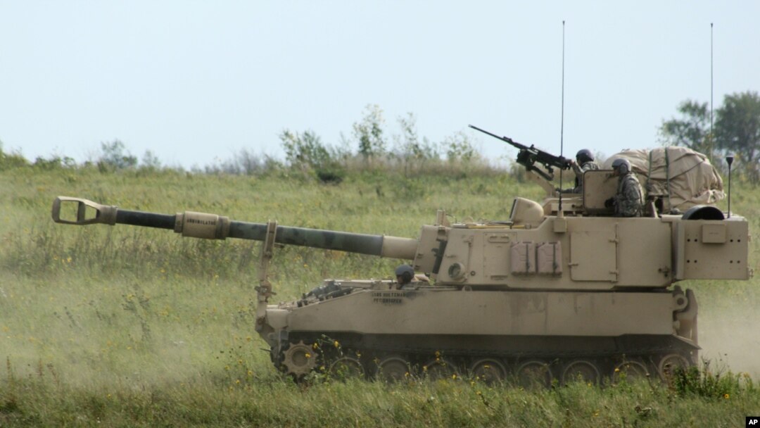 FILE - An Army Paladin self-propelled howitzer and its crew advances during a training exercise at Fort Riley, Kan., Sept. 12, 2012. The latest U.S. arms sale to Saudi Arabia, announced April 5, 2018, includes about 180 Paladin systems.