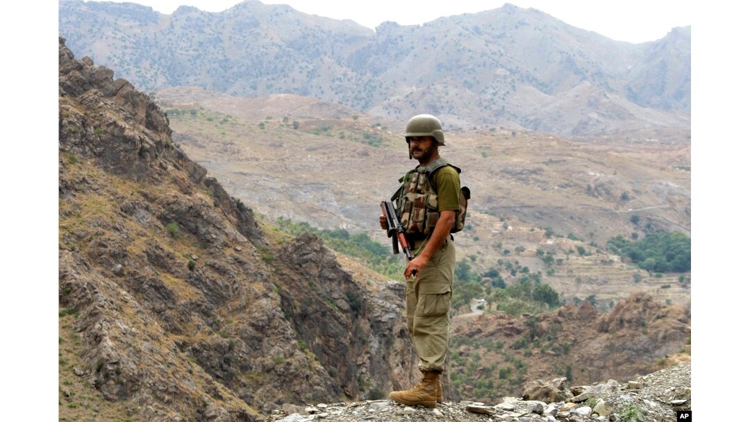 FILE - A Pakistan army soldier stands guard in the Pakistani tribal area of Khyber near the Torkham border post between Pakistan and Afghanistan, June 15, 2016.