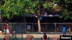 FILE - Children of the Australian Aboriginal community of Ramingining play in East Arnhem Land, located east of the Northern Territory city of Darwin. Judge Greg Borchers has been has been accused of racism towards Indigenous defendants. 