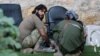 Rebel fighters of al-Jabha al-Shamiya (Levant Front) have their meal in the rebel-held al-Sheikh Said neighborhood of Aleppo, Syria, Sept.1, 2016.