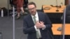 Defense attorney Eric Nelson mimics someone feigning a medical emergency as he makes closing arguments during the trial of former Minneapolis police officer Derek Chauvin for second-degree murder.