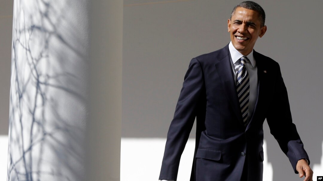 President Barack Obama looks towards reporters as he walks down the West Wing Colonnade of the White House on February 12, 2013, ahead of his State of the Union speech on Capitol Hill. 
