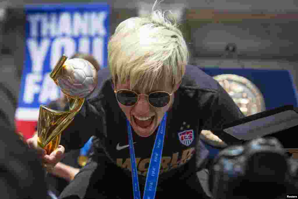 Megan Rapinoe poses for members of the press during a reception at New York City Hall for the U.S. women's soccer team following their ticker-tape parade to celebrate their World Cup final win on Sunday, in New York, July 10, 2015.