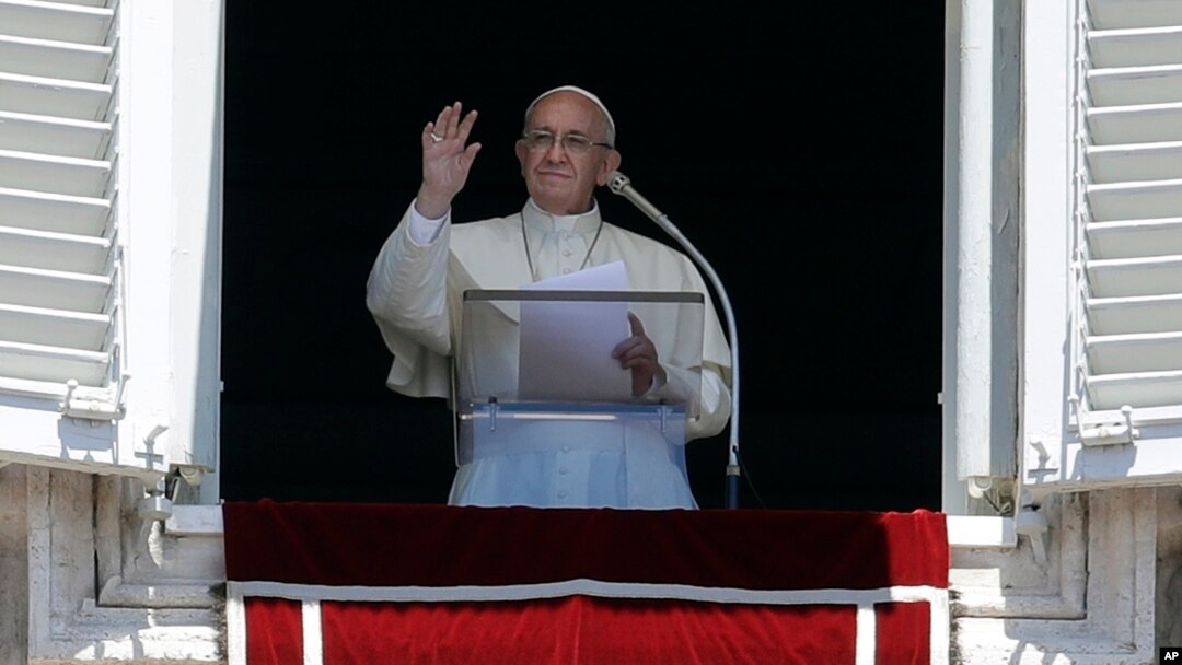 Pope Francis recites the Regina Coeli prayer from his studio's window overlooking St. Peter's Square at the Vatican, Sunday, May 28, 2017.