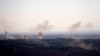 Smoke and explosions from the fighting between forces loyal to Syrian President Bashar Assad and rebels rise in the village of Jubata al-Khashab as seen from the Israeli-controlled Golan Heights, Sept. 11, 2016.
