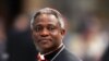 Cardinal Peter Kodwo Appiah Turkson of Ghana arrives to attend a mass led by bishop Leonardo Sandri of Argentina in St. Peter's Basilica at the Vatican, April 13, 2005.