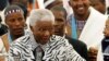 Former South African President Nelson Mandela, centre, followed by his grandson Mandla Mandela, rear right, arrives at a ceremony in Mvezo, South Africa, April 16, 2007.