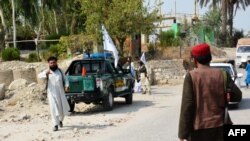 Taliban members inspect near the site of a blast in Jalalabad, Afghanistan, Sept. 18, 2021.