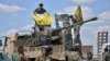 FILE - Soldiers participate in an operation to liberate Raqqa, Syria, from Islamic State militants, May 24, 2016. (Credit: ANHA)