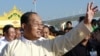 Burmese Vice President Tin Aung Myint Oo waves to residents during the inauguration ceremony of the Ayeyarwaddy Bridge in Pokokku, central Burma, December 31. 2011. 