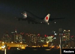 A Japanese government aircraft, which will bring home the bodies and Japanese survivors from the hostage crisis in Algeria, takes off at Haneda airport in Tokyo in this photo taken and provided by Kyodo, January 22, 2013.