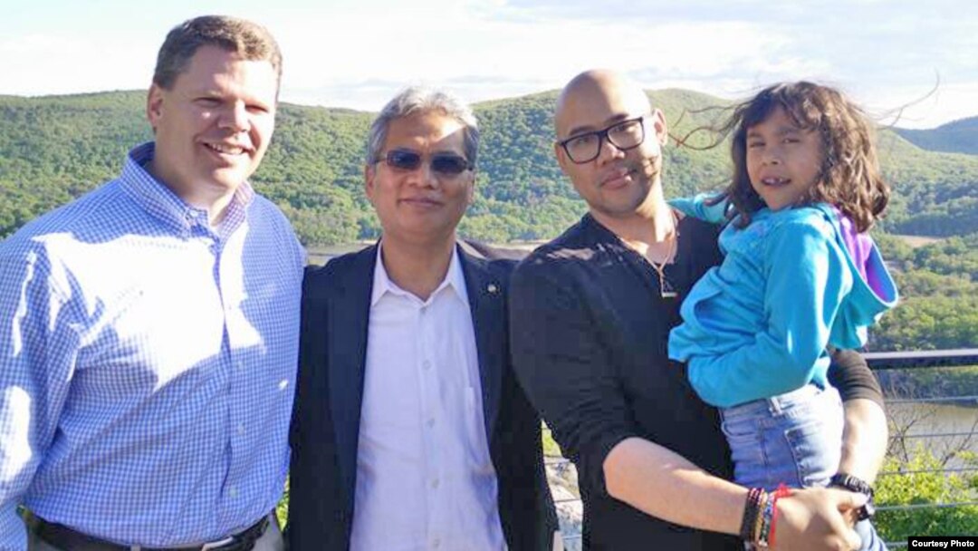 Taylor Tagg (left) Timothy Chhim (middle) and Tony Chhim are pictured in Nanuet, New York, May 14, 2017. The Taggs visited the Chhims for a Buddhist blessing for an operation scheduled for May 25, 2017. (Photo courtesy of Taylor Tagg)