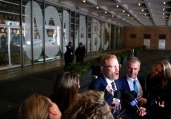 FILE - Craig McMurtie, editorial director of the Australian Broadcasting Corp (ABC), speaks to members of the media outside the ABC building in Sydney, June 5, 2019.