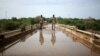 Members of Amhara special forces stand guard on the Tekeze river bridge near Ethiopia-Eritrean border near the town of Humera, Ethiopia, July 1, 2021.