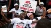 Kenyan demonstrators, march towards parliament in Nairobi, Kenya, June 11, 2013, as they protest against what they see as the greed of their legislator leaders. 