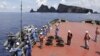Workers on the city government of Tokyo's survey vessel prepare to survey around a group of disputed islands known as Senkaku in Japan and Diaoyu in China in the East China Sea September 2, 2012. 