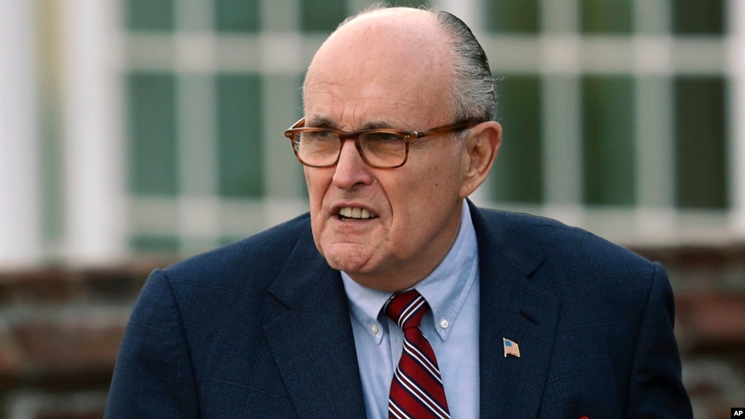 FILE - Former New York Mayor Rudy Giuliani arrives at the Trump National Golf Club Bedminster clubhouse in Bedminster, N.J., Nov. 20, 2016. President Donald Trump's new lawyer, Rudy Giuliani, said Wednesday the president repaid attorney Michael Cohen for a $130,000 payment to porn star Stormy Daniels.